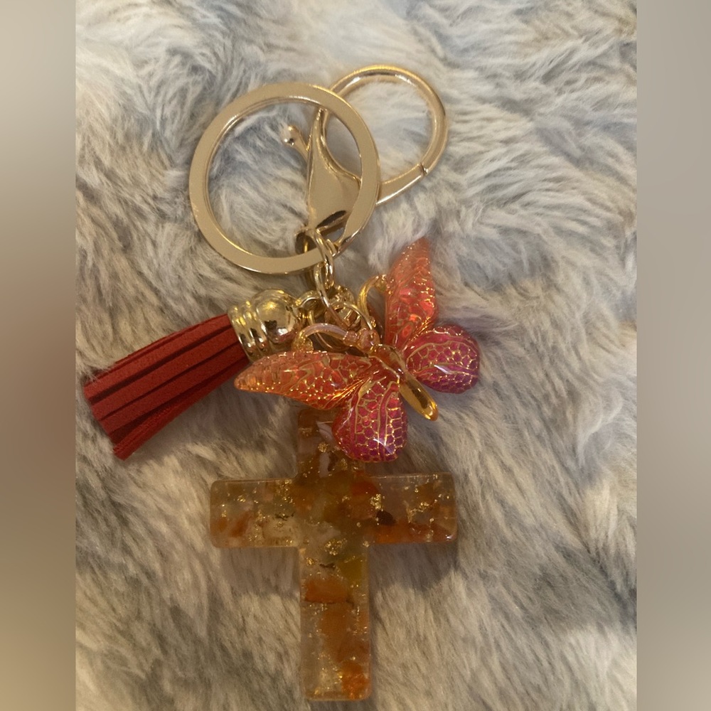 Beautitul cross and butterfly 🦋 purse charm and key
chain with tassel